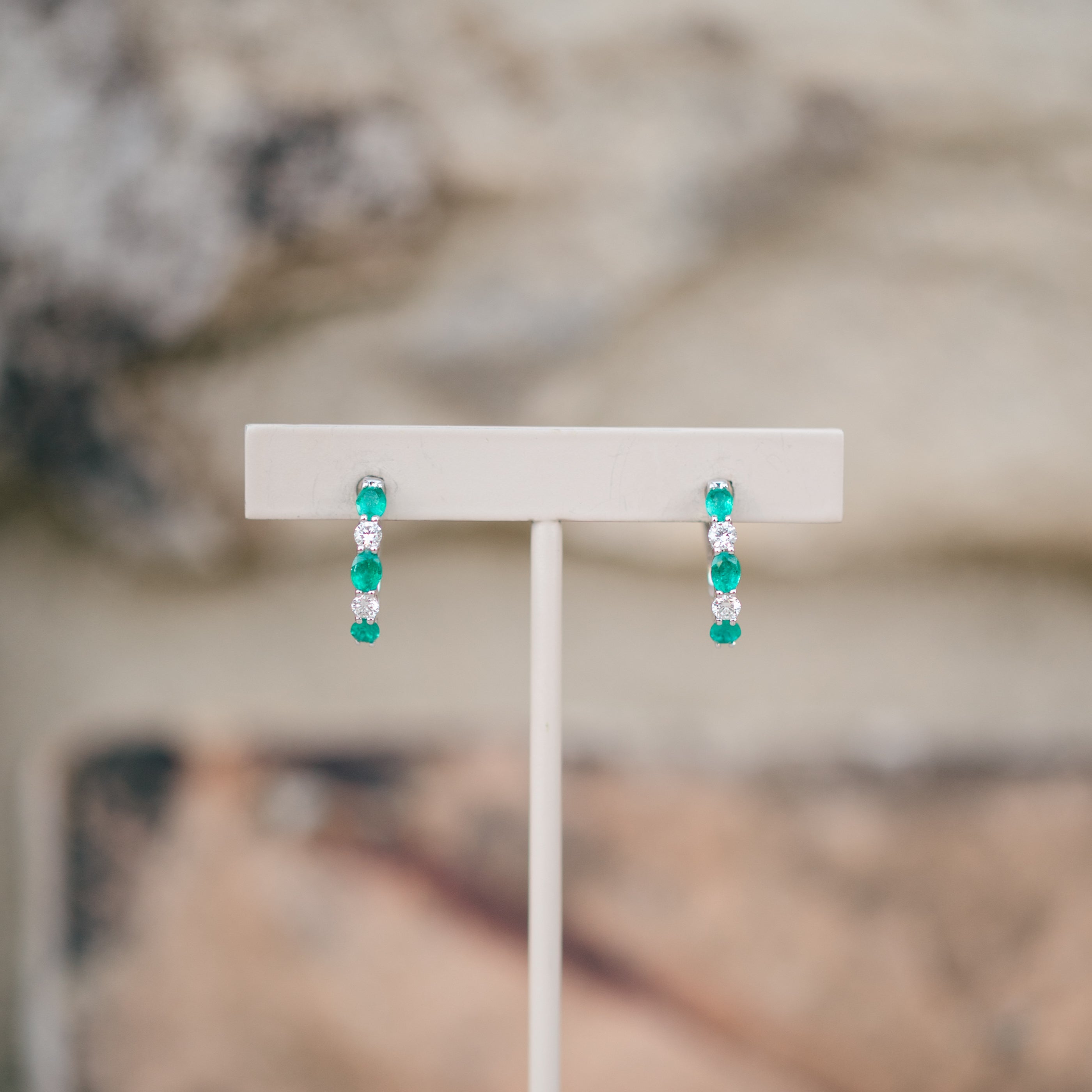 oval emerald and diamond hoops
