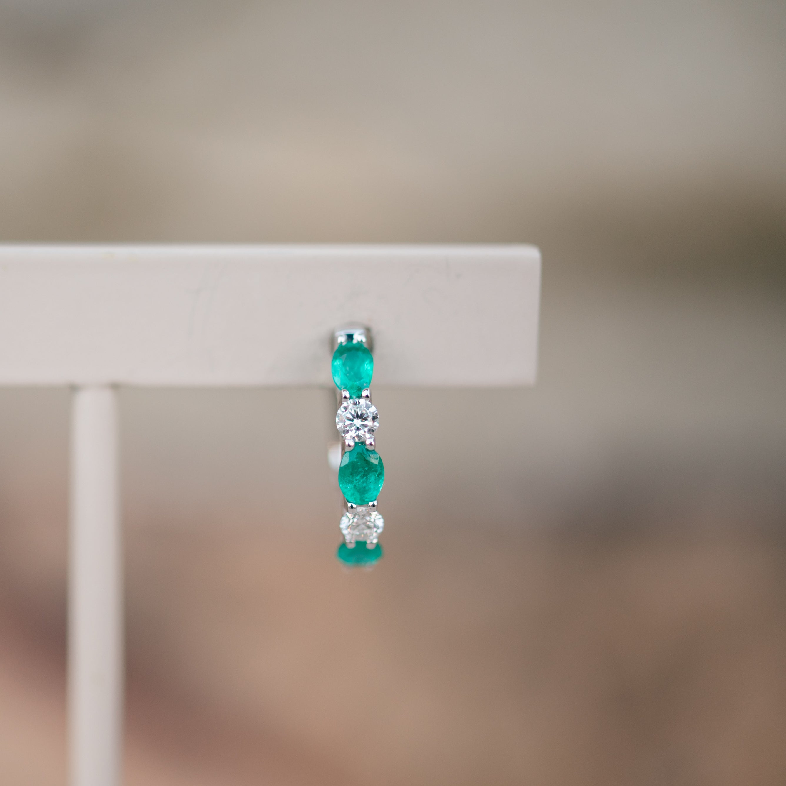 oval emerald and diamond hoops