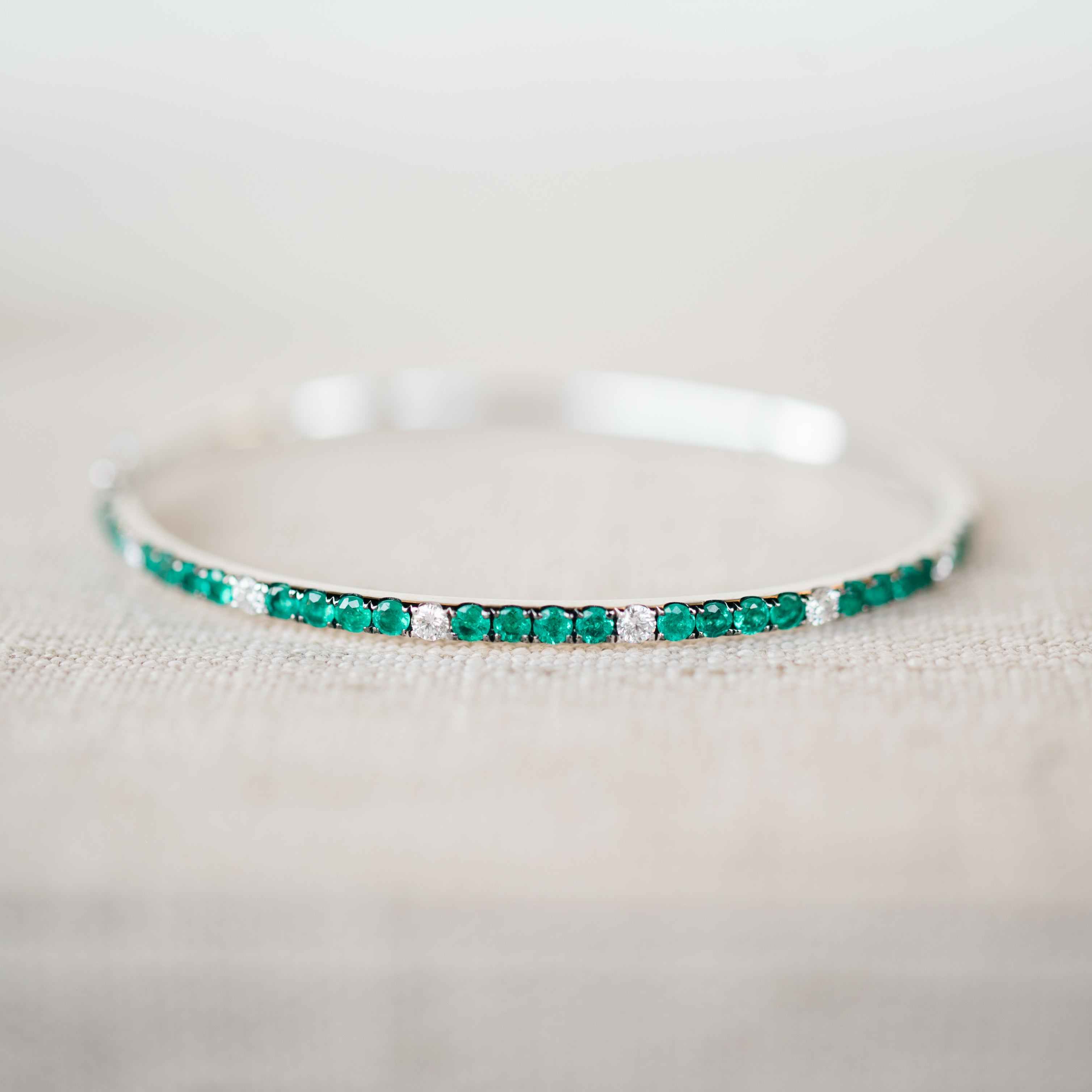 White Gold Diamond and Emerald Bangle