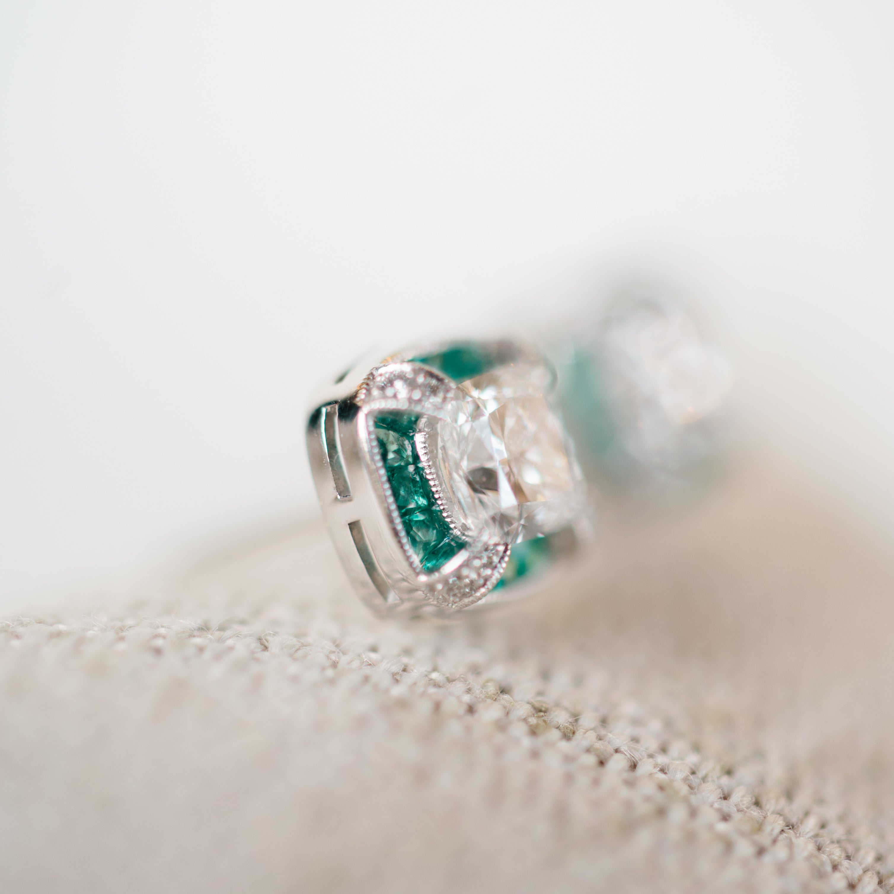 vintage inspired diamond and emerald halo earrings