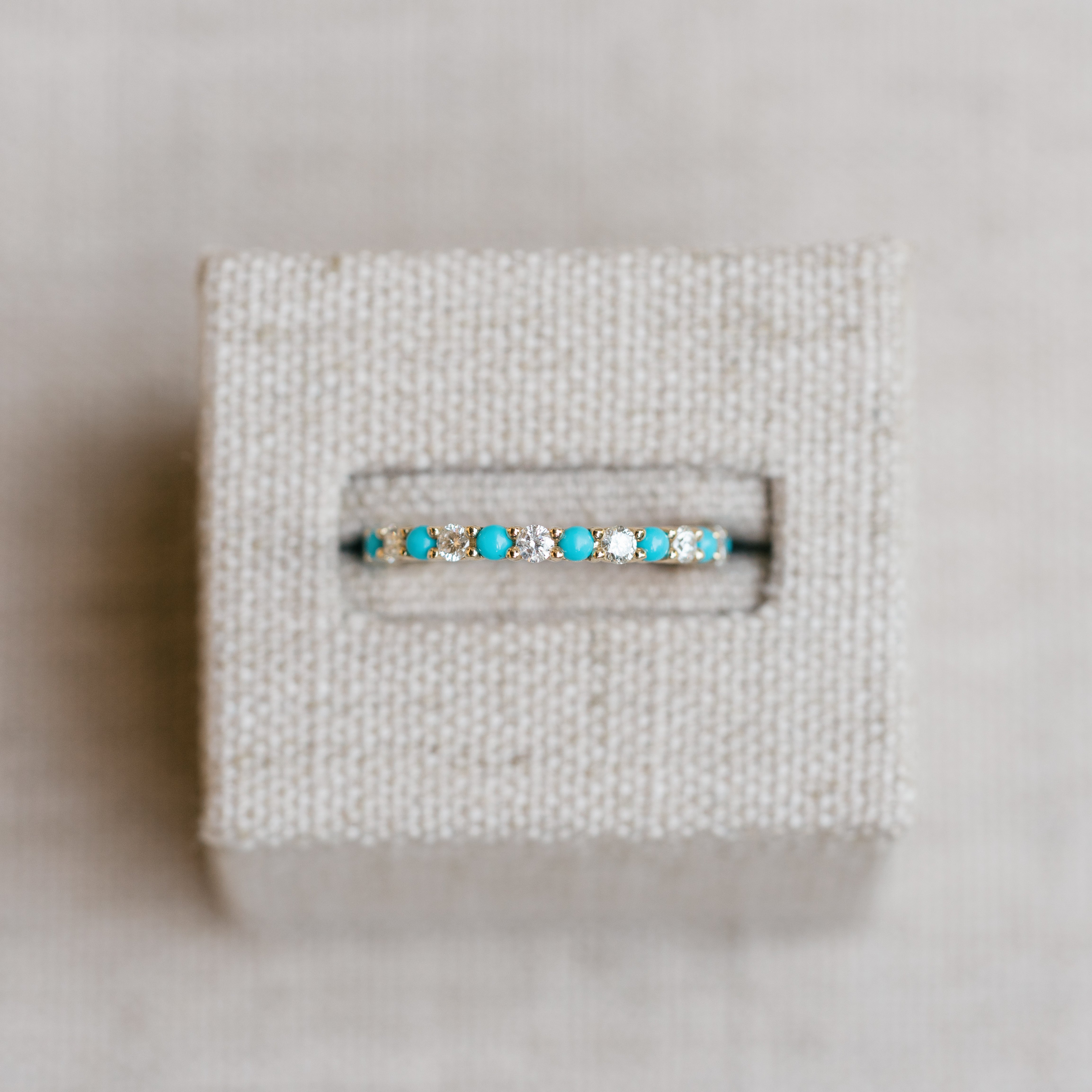 diamond and turquoise eternity band yellow gold