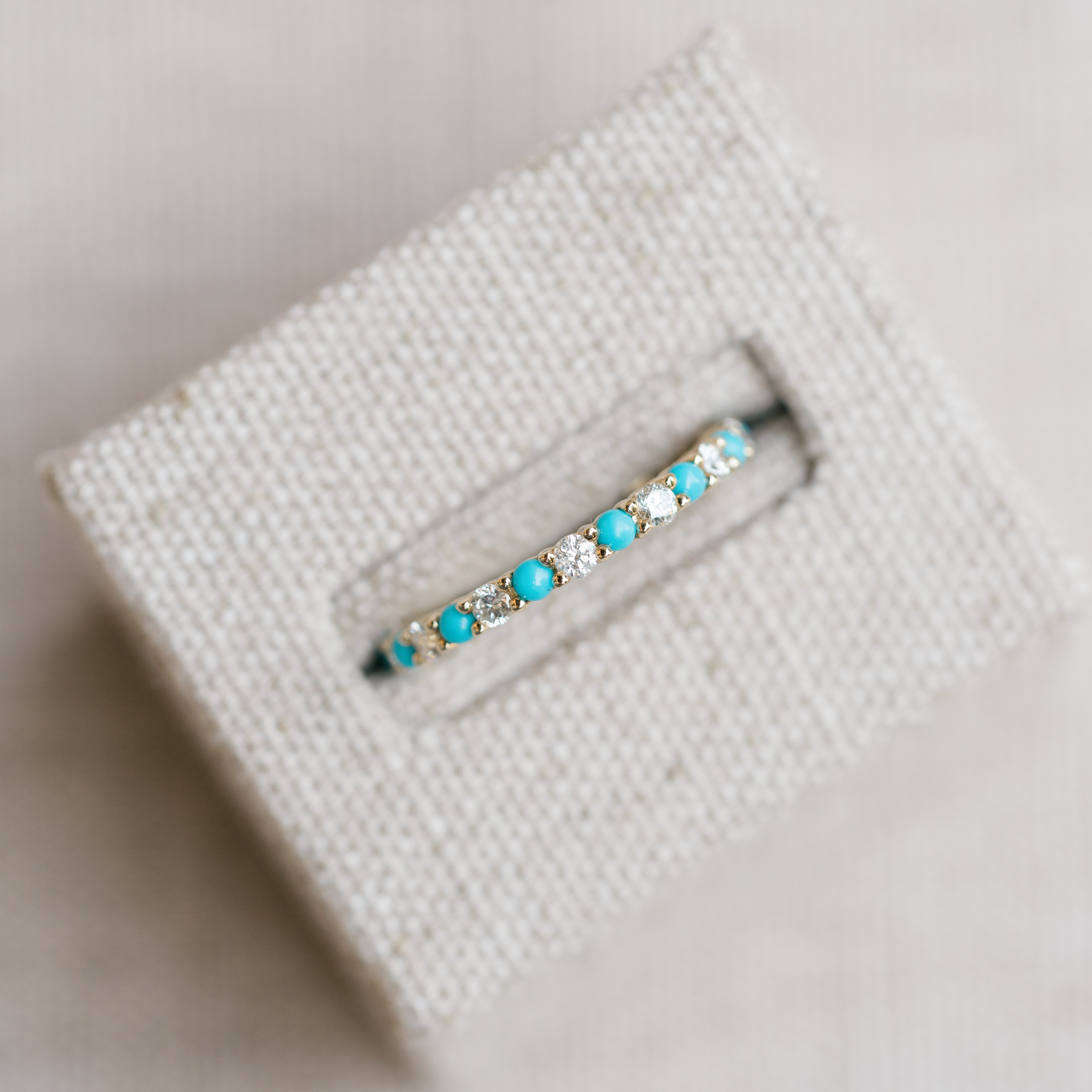 diamond and turquoise eternity band yellow gold