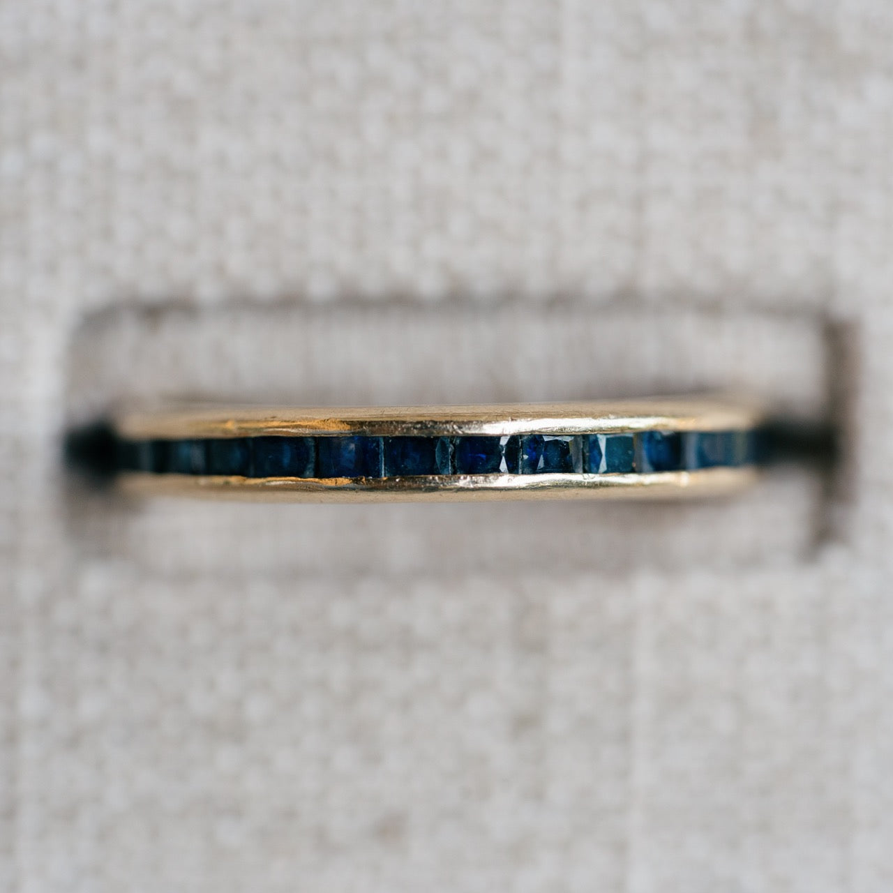 yellow gold french cut sapphire eternity band