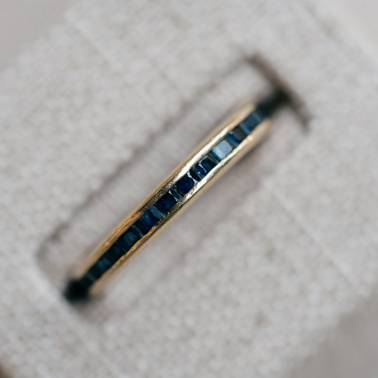 yellow gold french cut sapphire eternity band