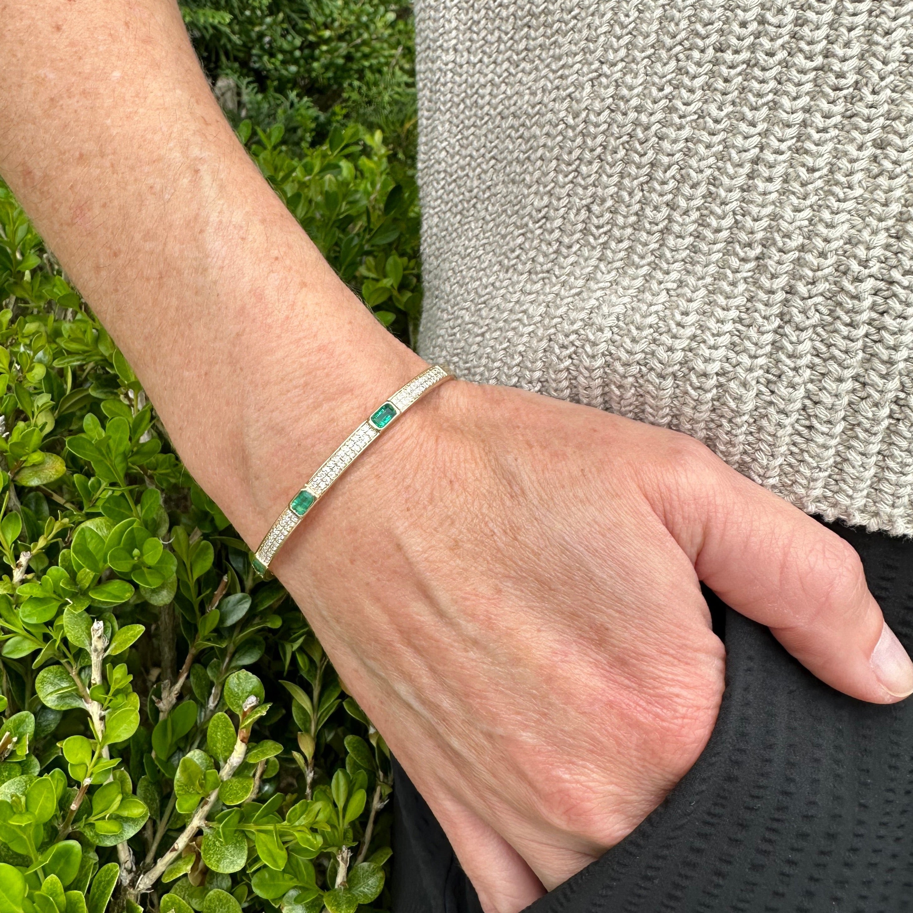 Emerald and diamond yellow gold bangle