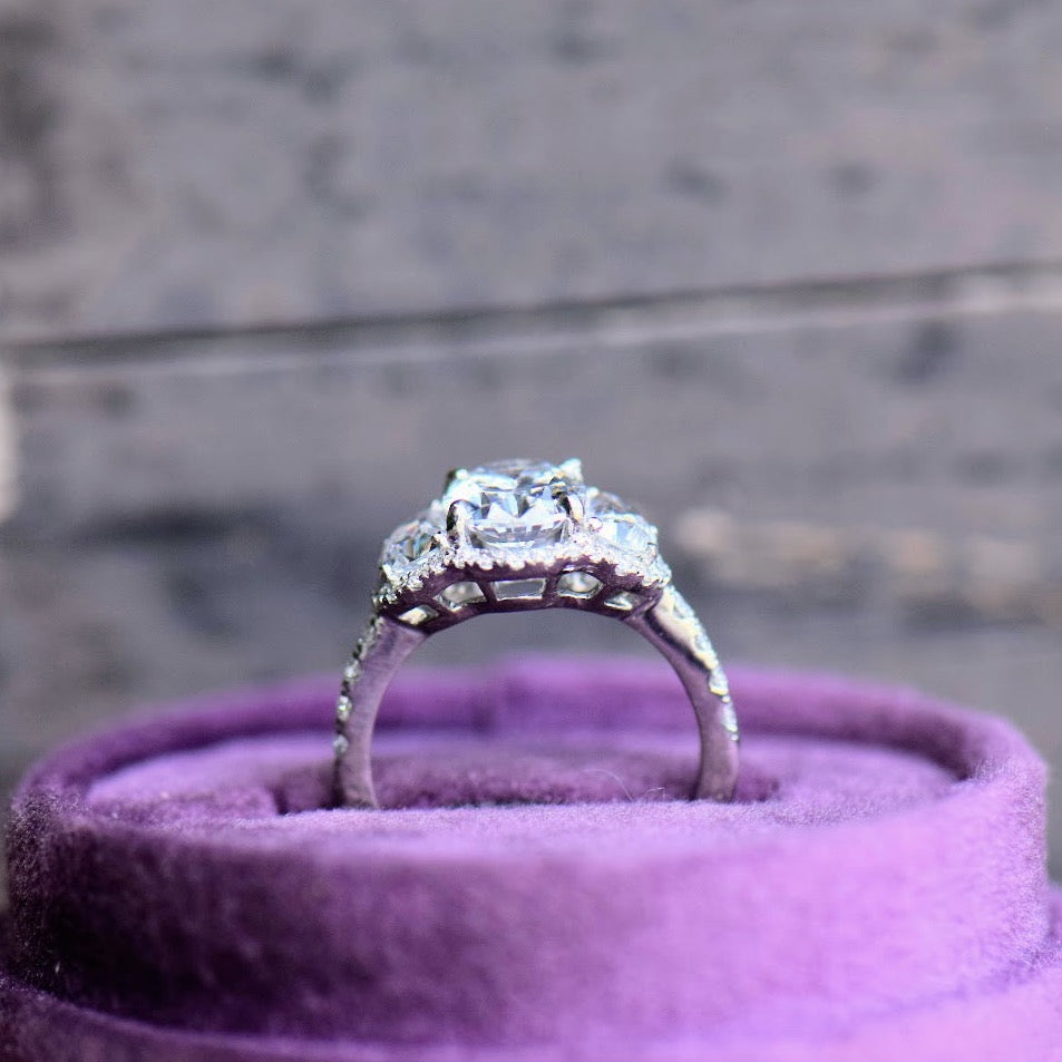 Platinum Three Stone Diamond Halo Ring