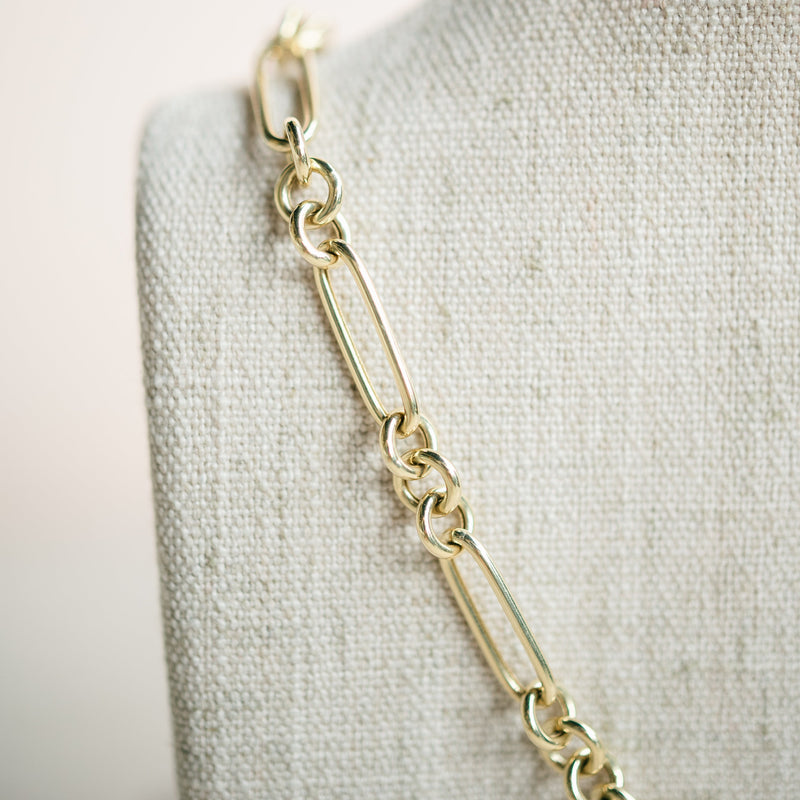 yellow gold figaro necklace with diamond connector