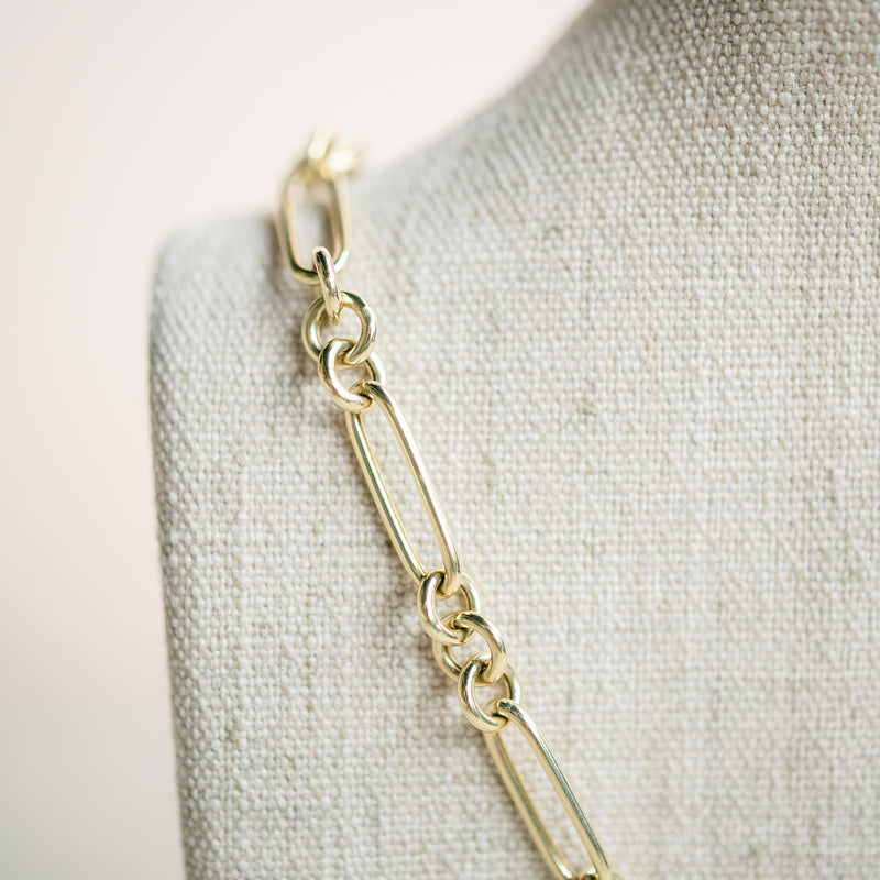 yellow gold figaro necklace with diamond connector