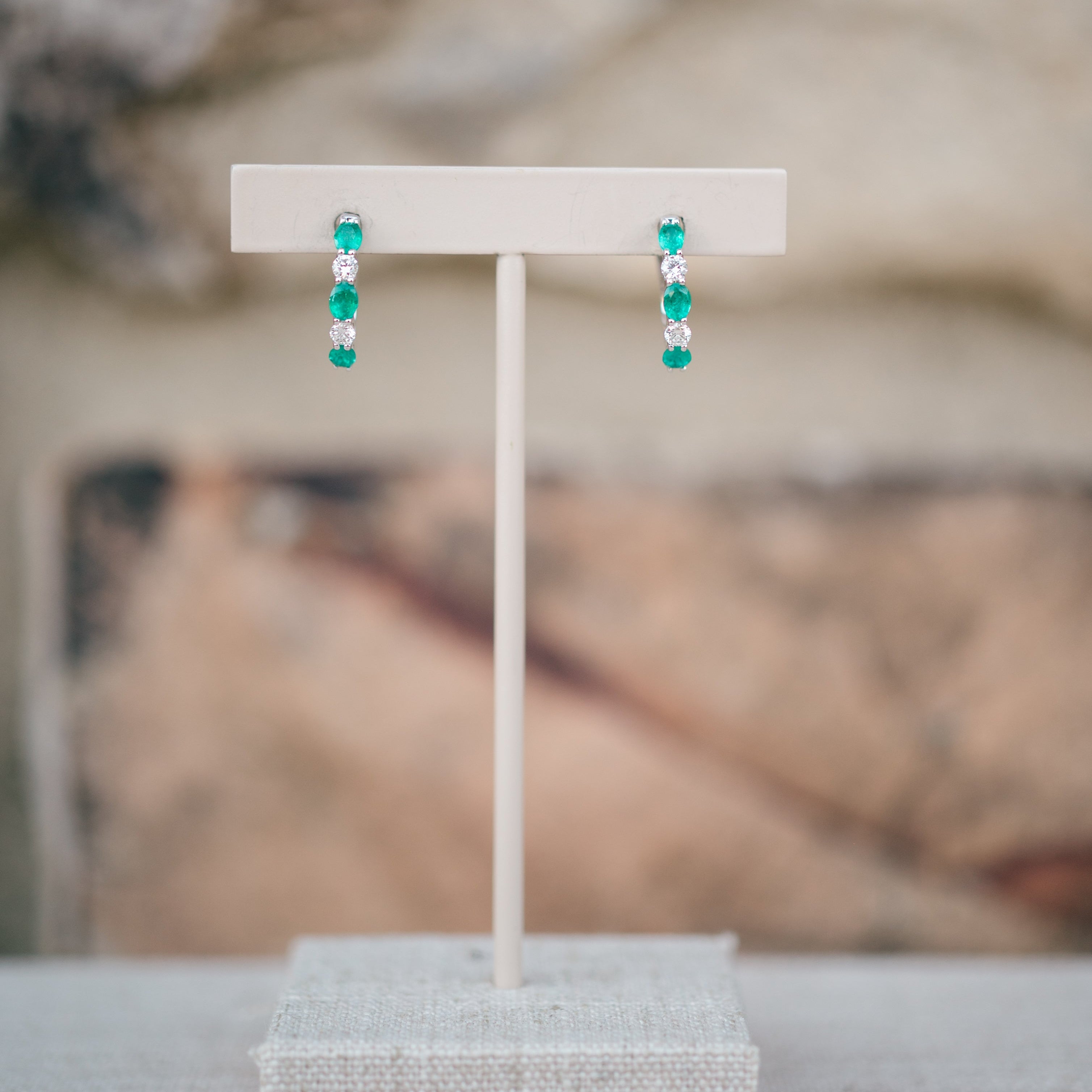 oval emerald and diamond hoops
