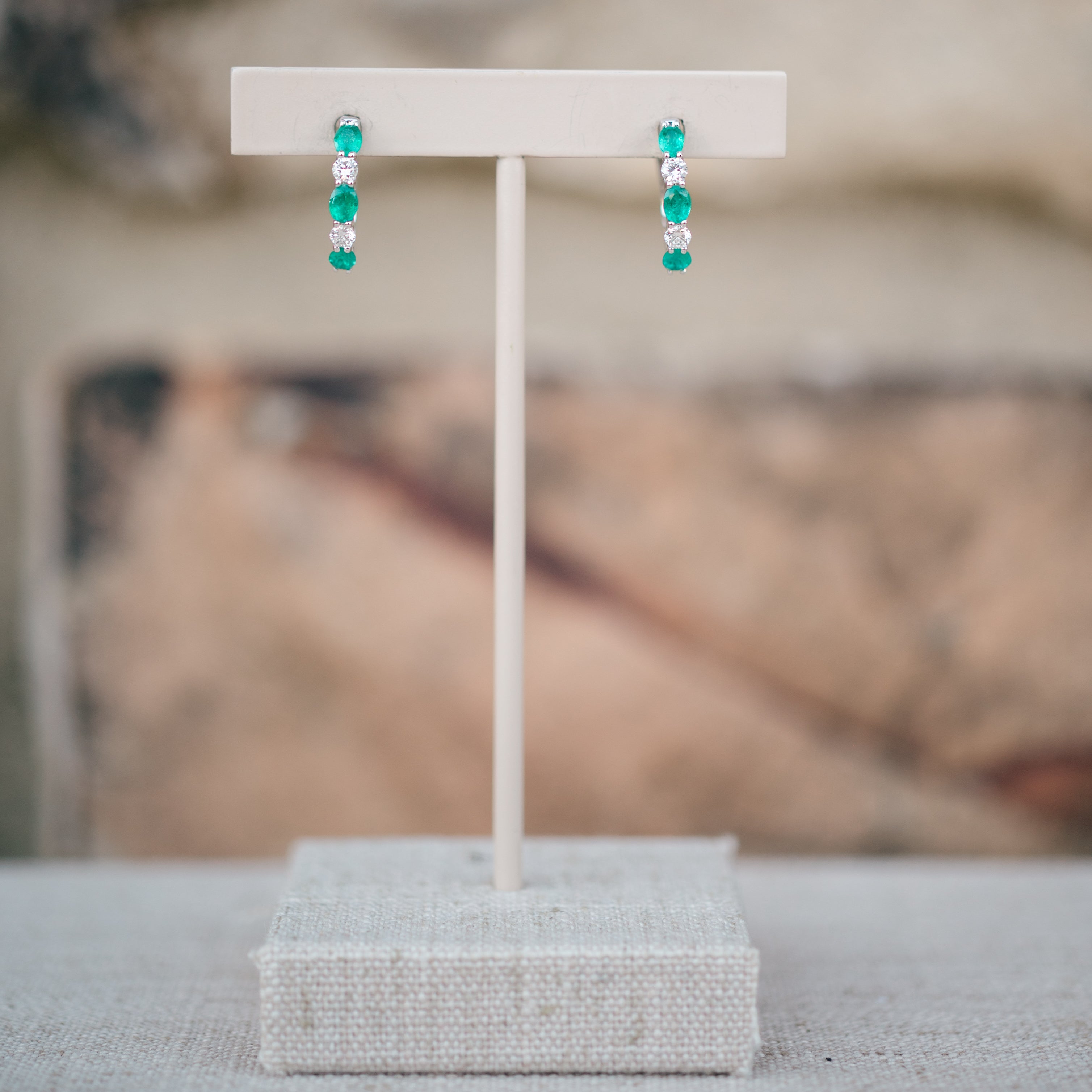 oval emerald and diamond hoops