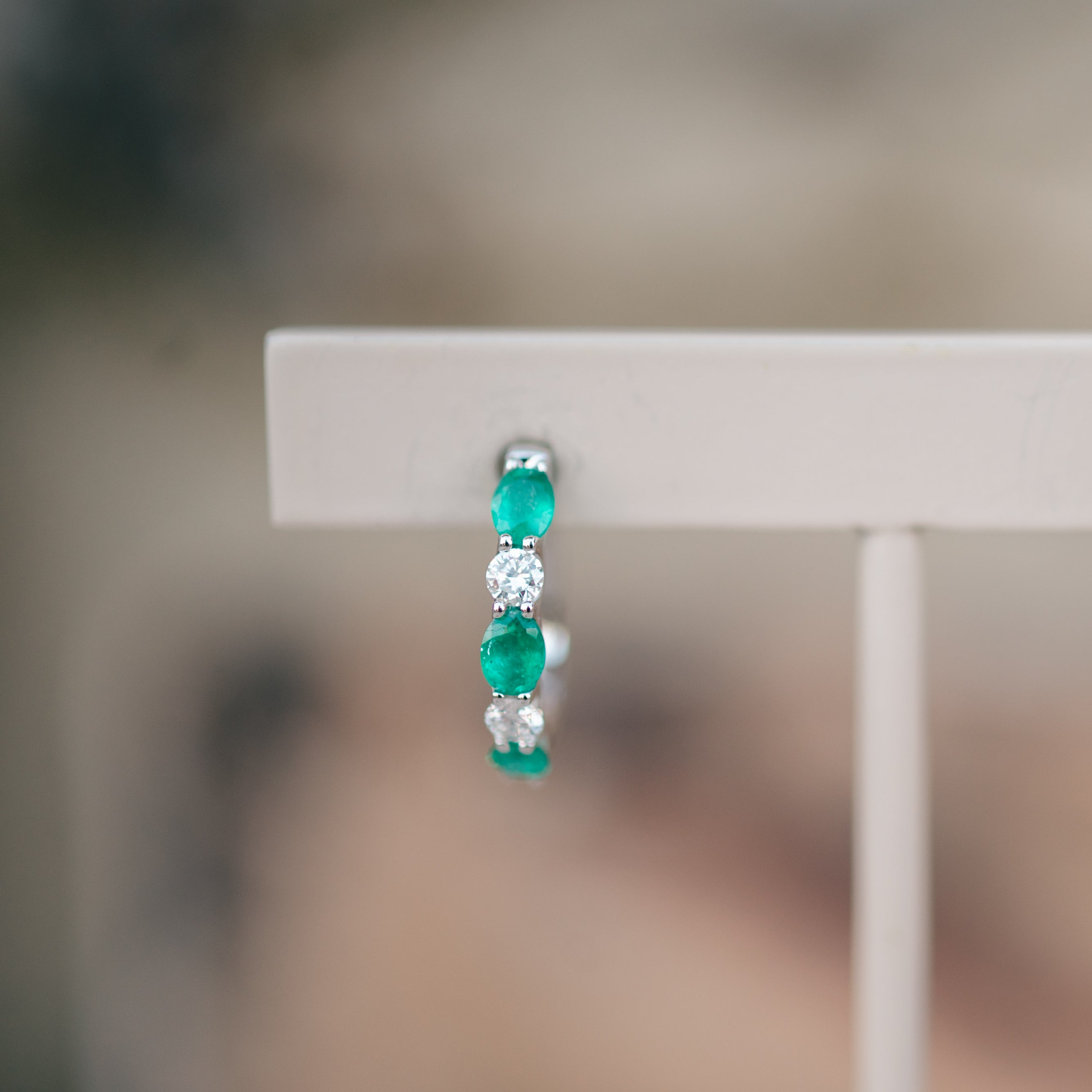 oval emerald and diamond hoops