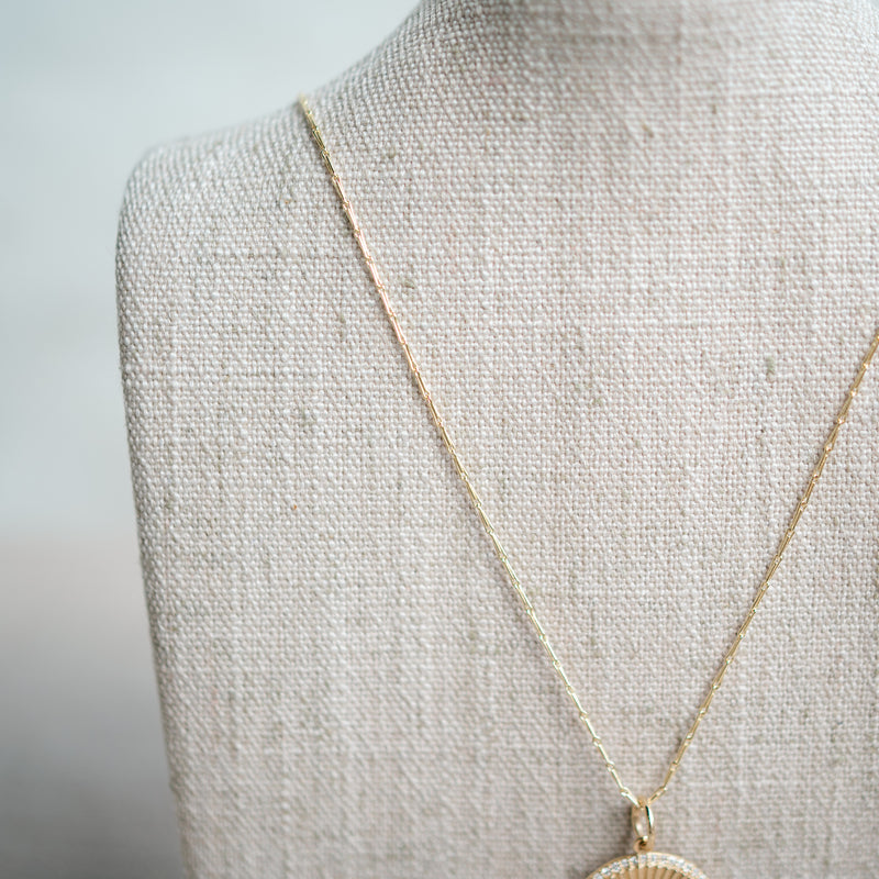 14k yellow gold emerald and diamond round necklace