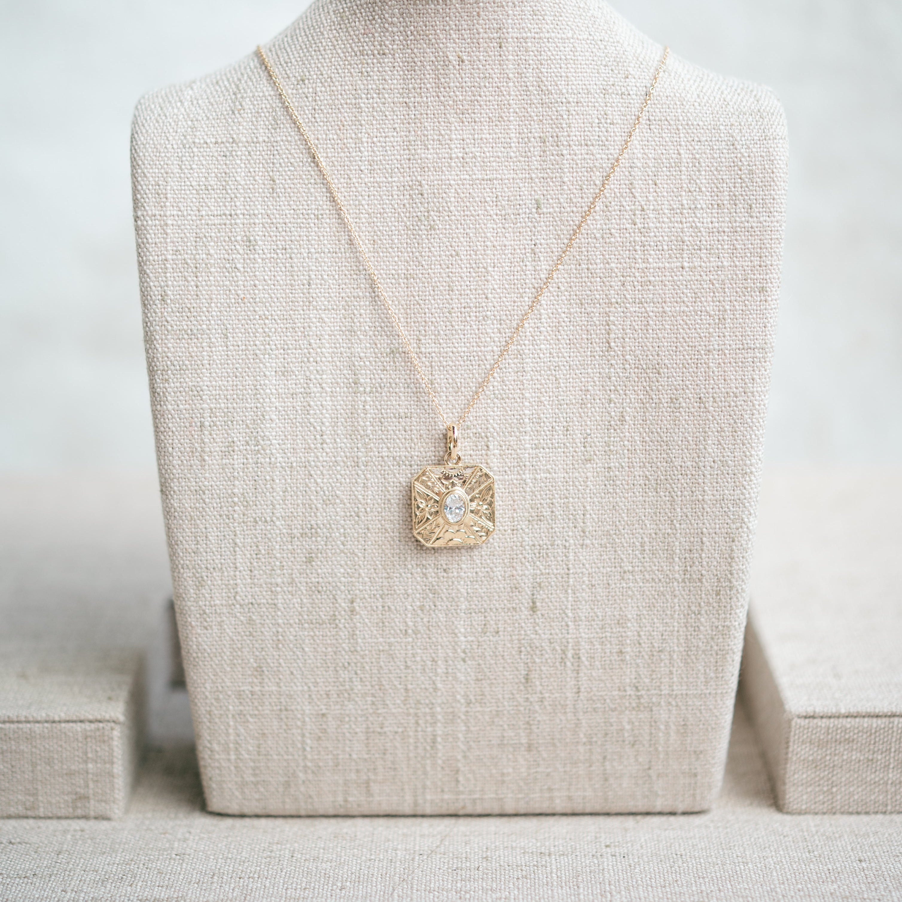 oval diamond engraved pendant