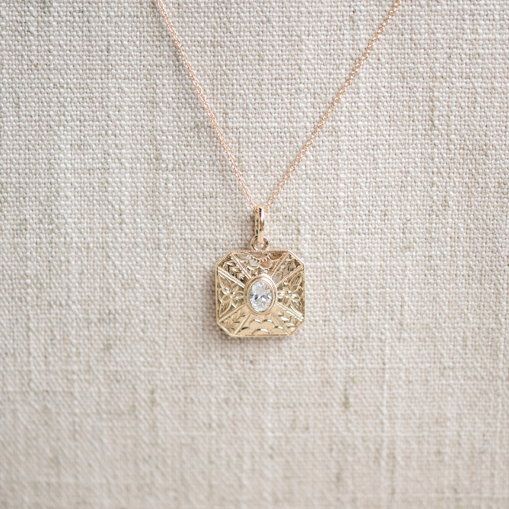 oval diamond engraved pendant