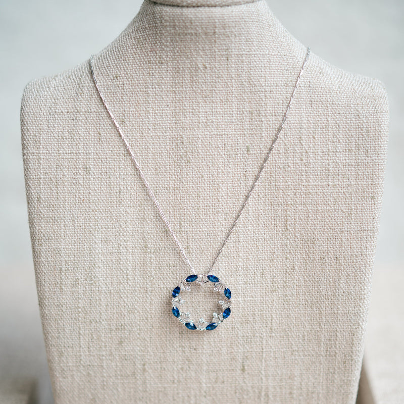 blue sapphire and diamond circle pendant