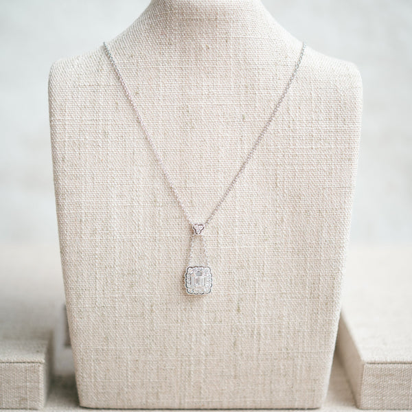 emerald cut diamond and scalloped diamond halo necklace