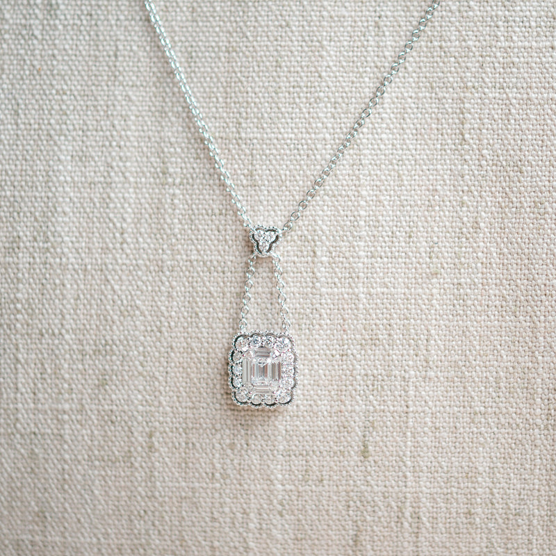 emerald cut diamond and scalloped diamond halo necklace