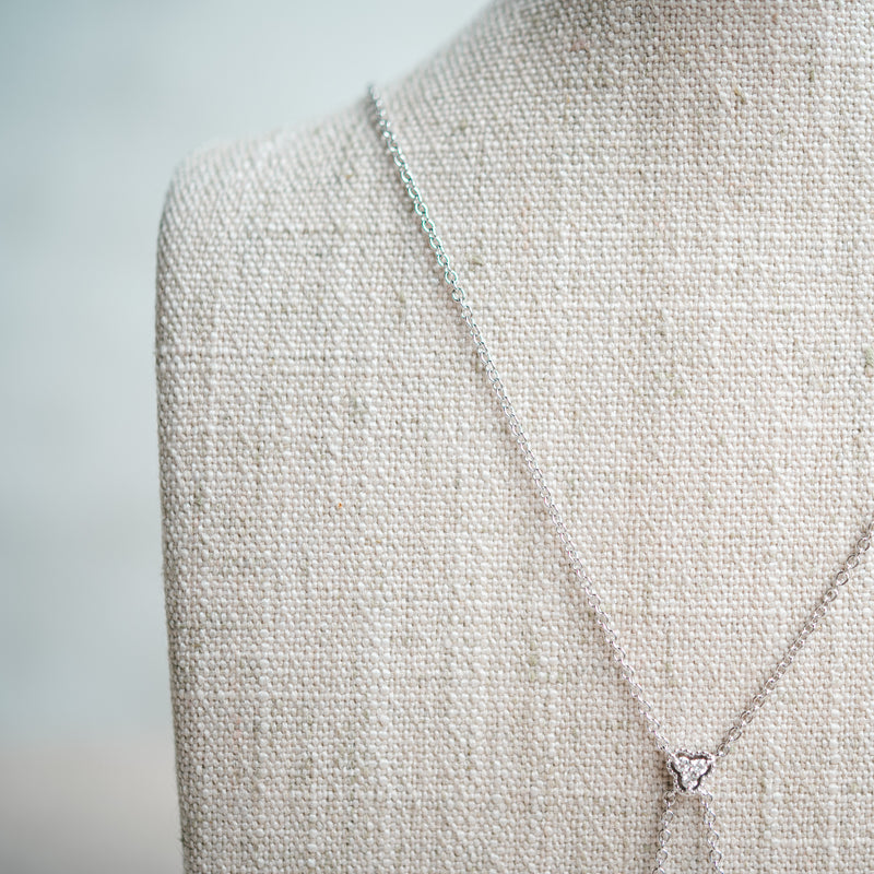 emerald cut diamond and scalloped diamond halo necklace