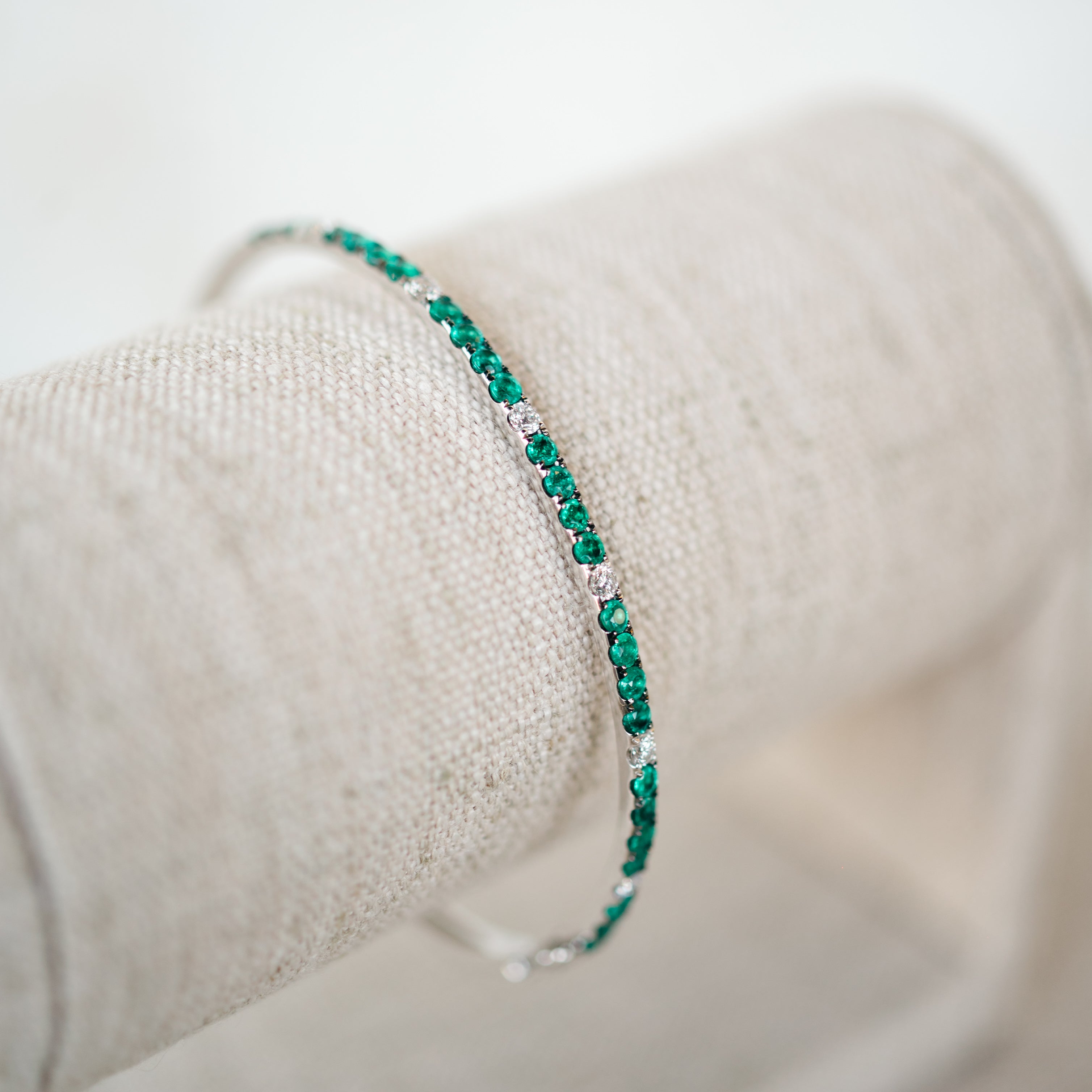 White Gold Diamond and Emerald Bangle