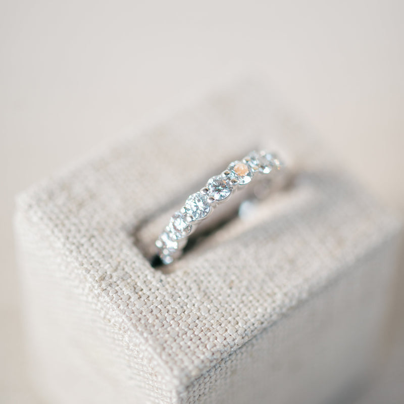 shared prong diamond eternity band