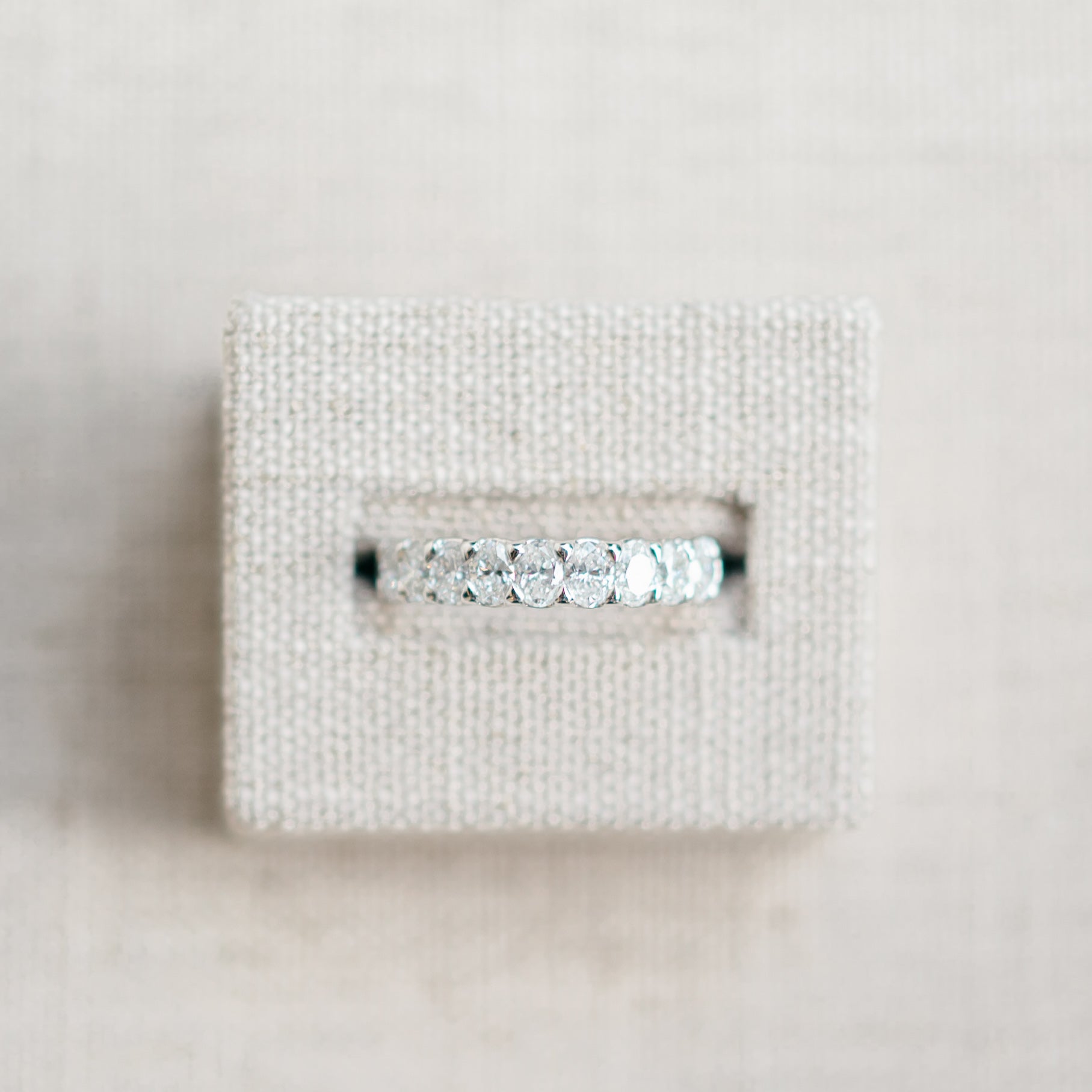 oval diamond half eternity band
