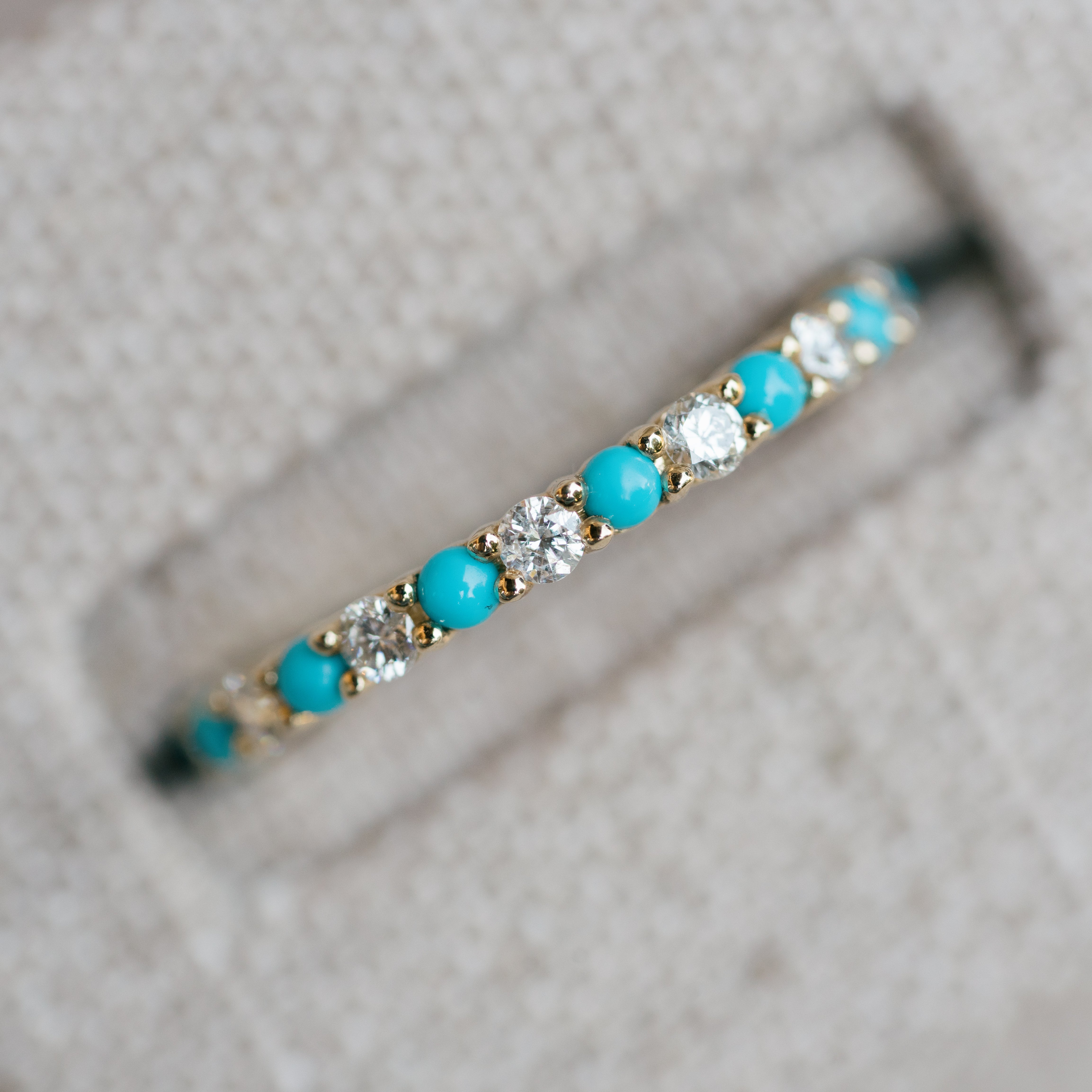 diamond and turquoise eternity band yellow gold