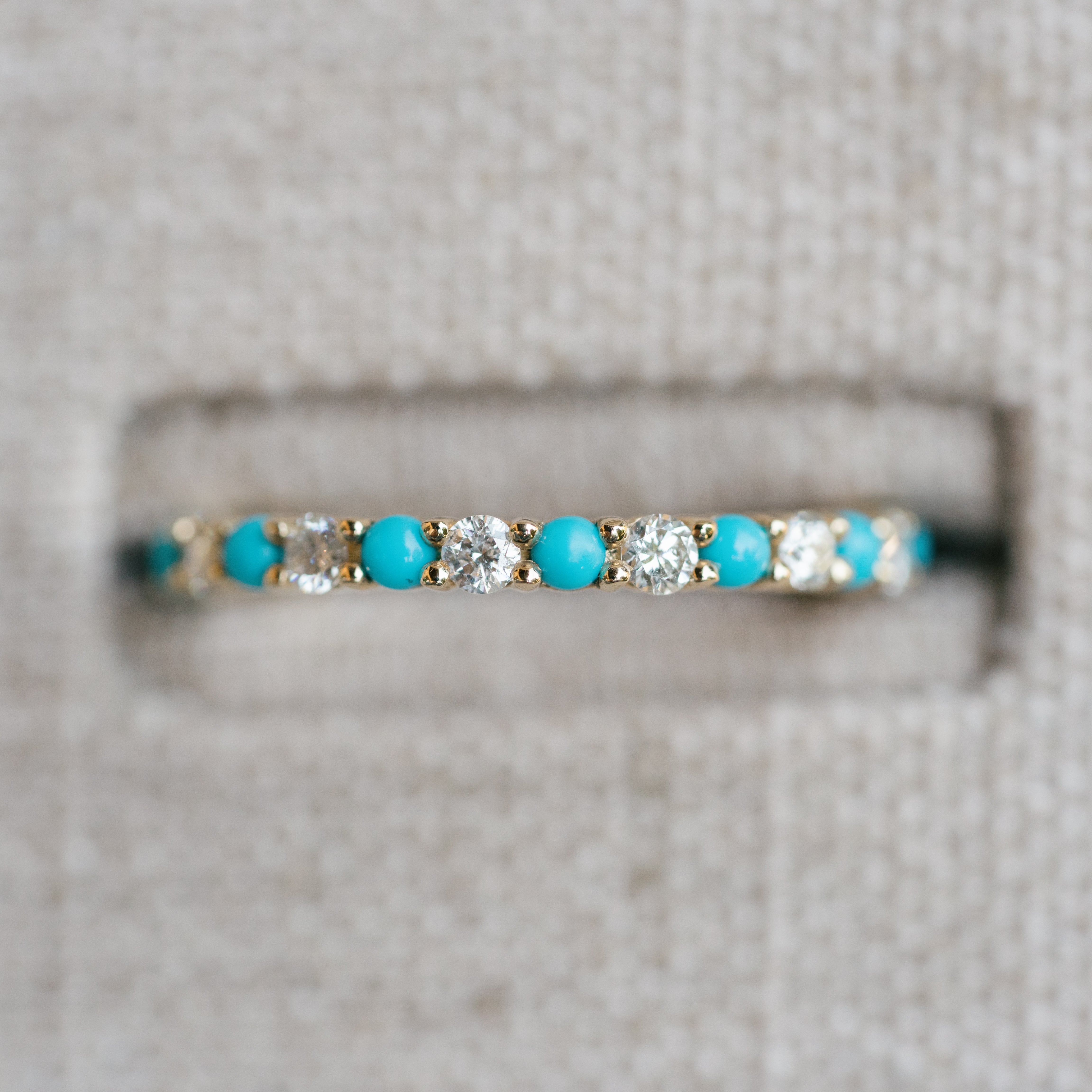 diamond and turquoise eternity band yellow gold
