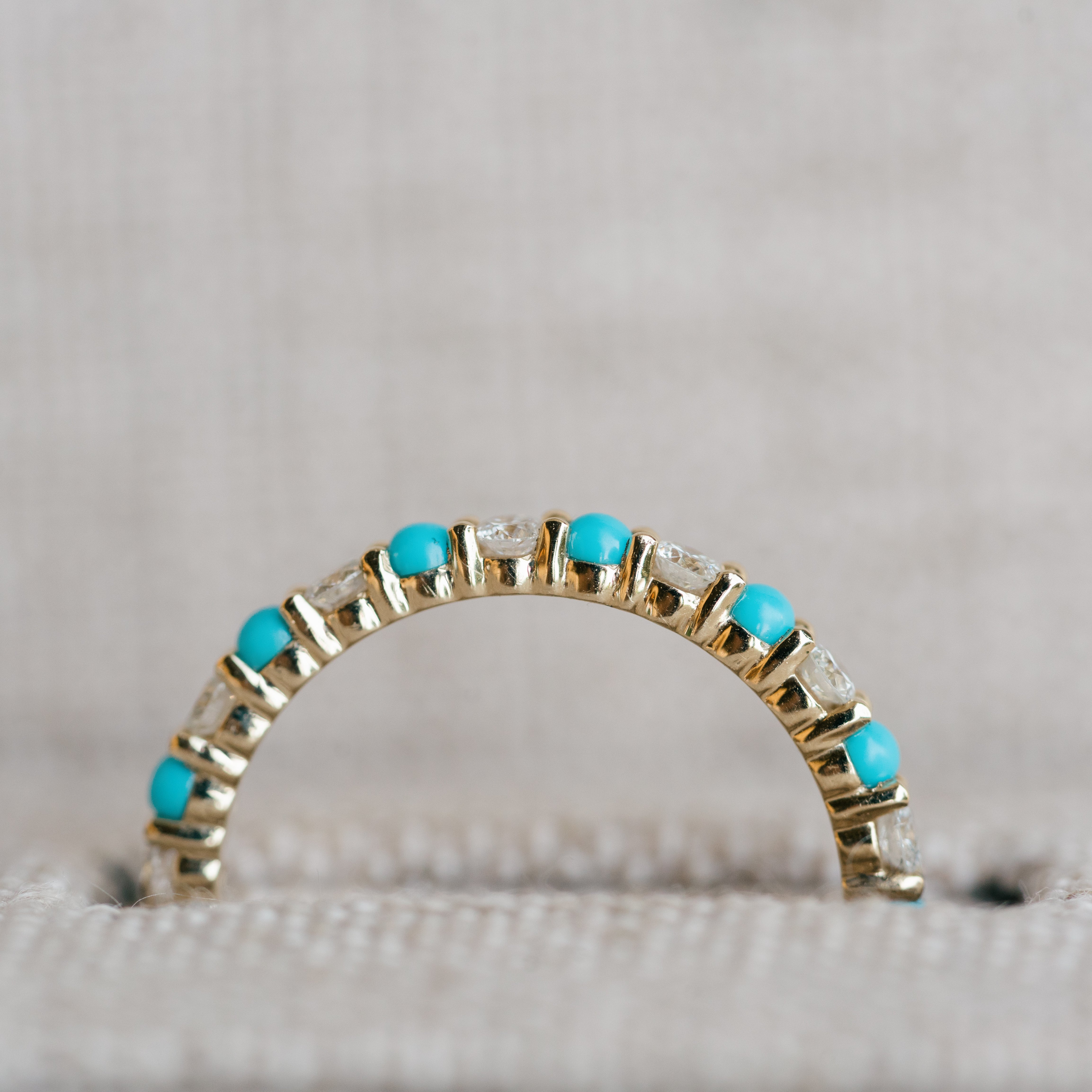 diamond and turquoise eternity band yellow gold