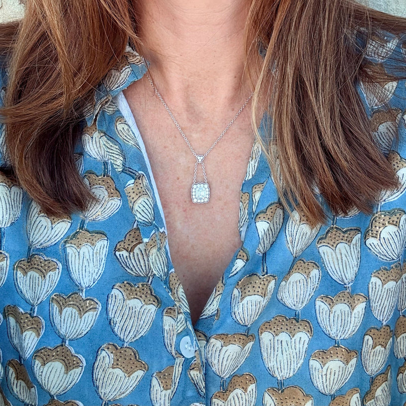 emerald cut diamond and scalloped diamond halo necklace
