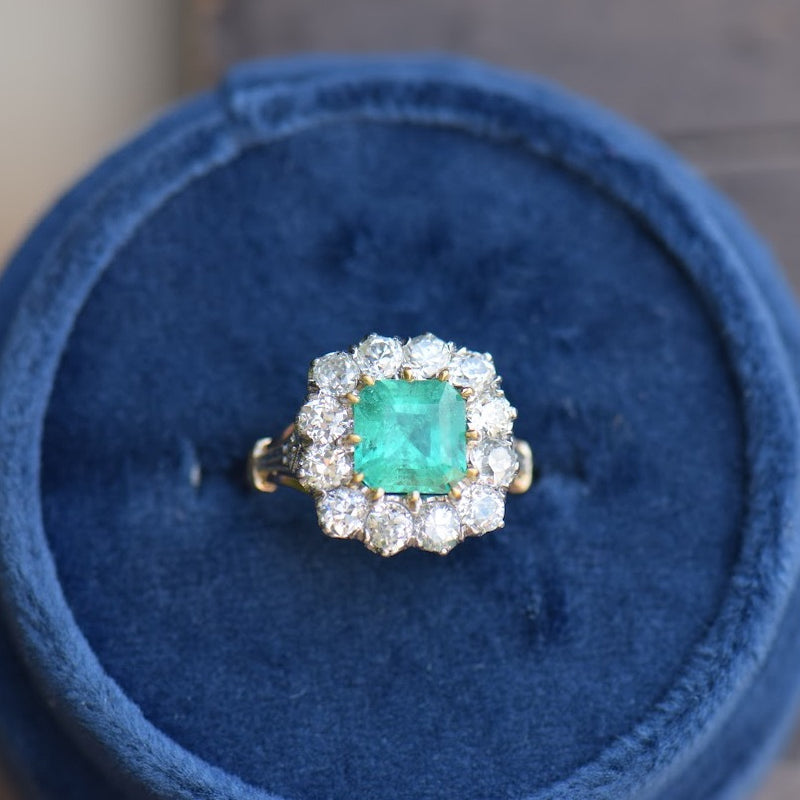 emerald and diamond mixed metal ring