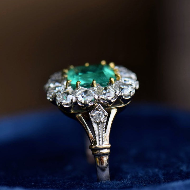 emerald and diamond mixed metal ring