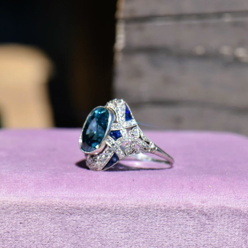 Blue zircon diamond and sapphire ring