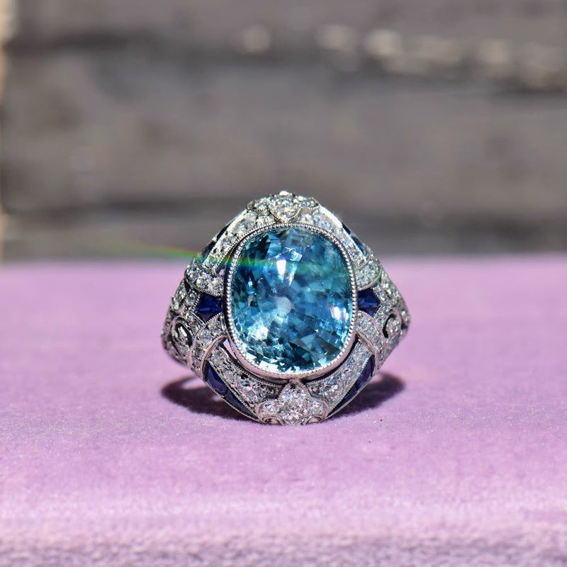 Blue zircon diamond and sapphire ring