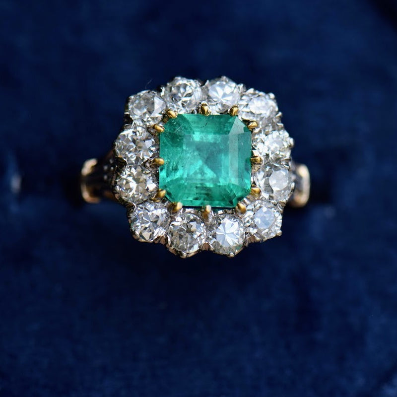 emerald and diamond mixed metal ring