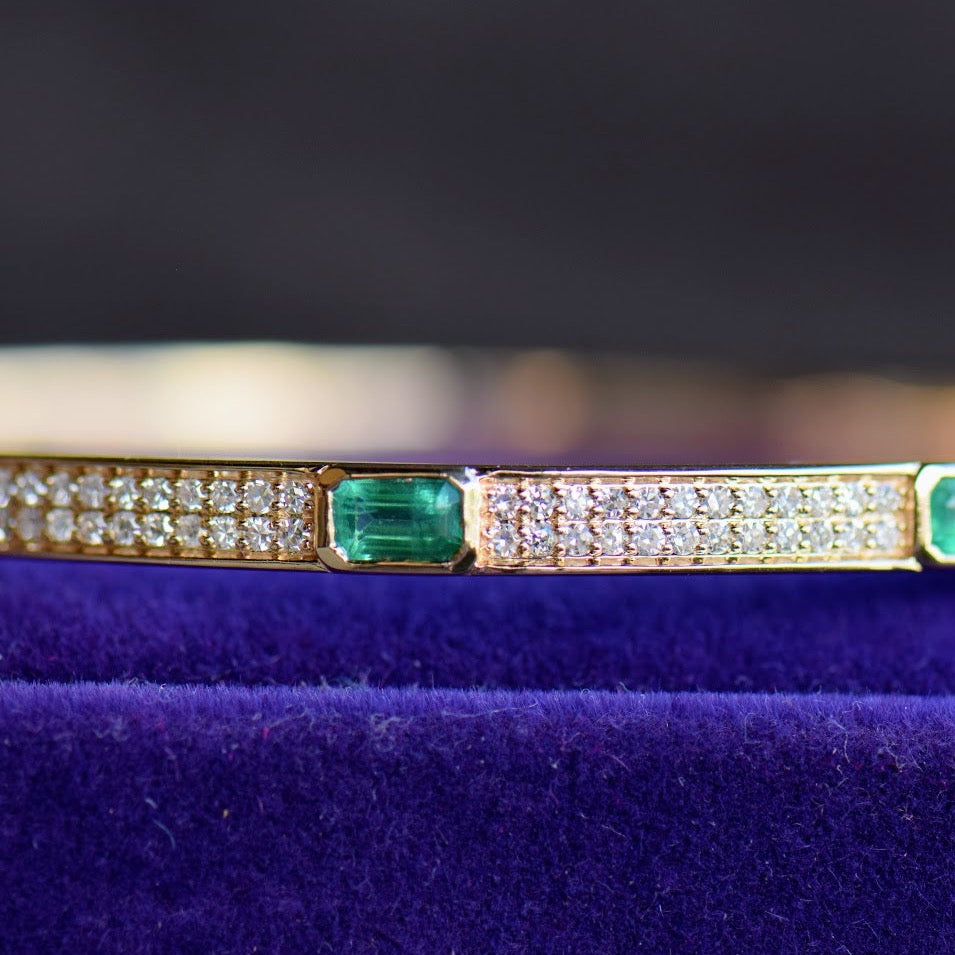 Emerald and diamond yellow gold bangle