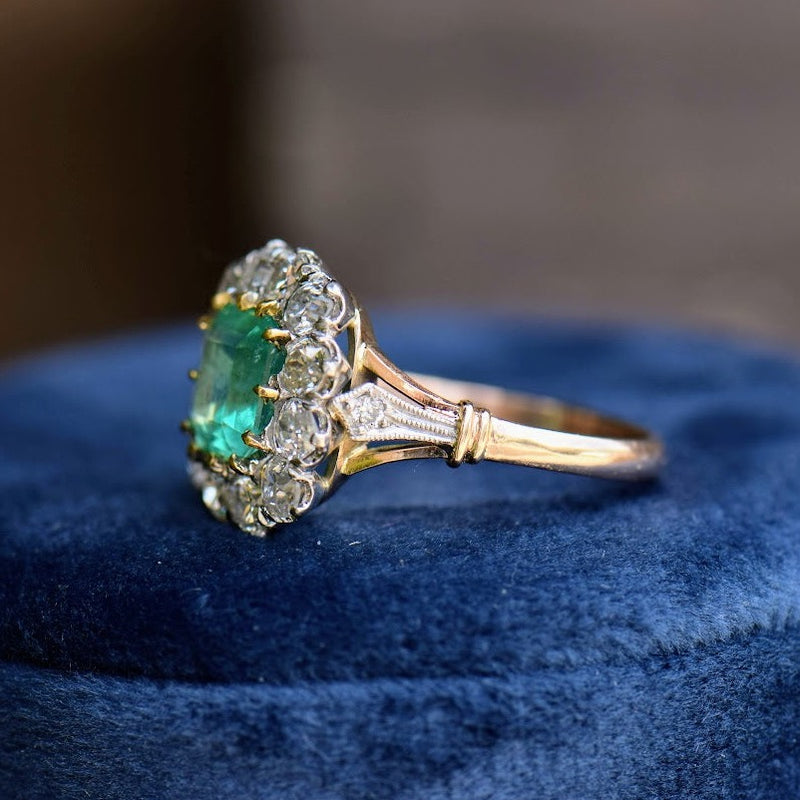 emerald and diamond mixed metal ring