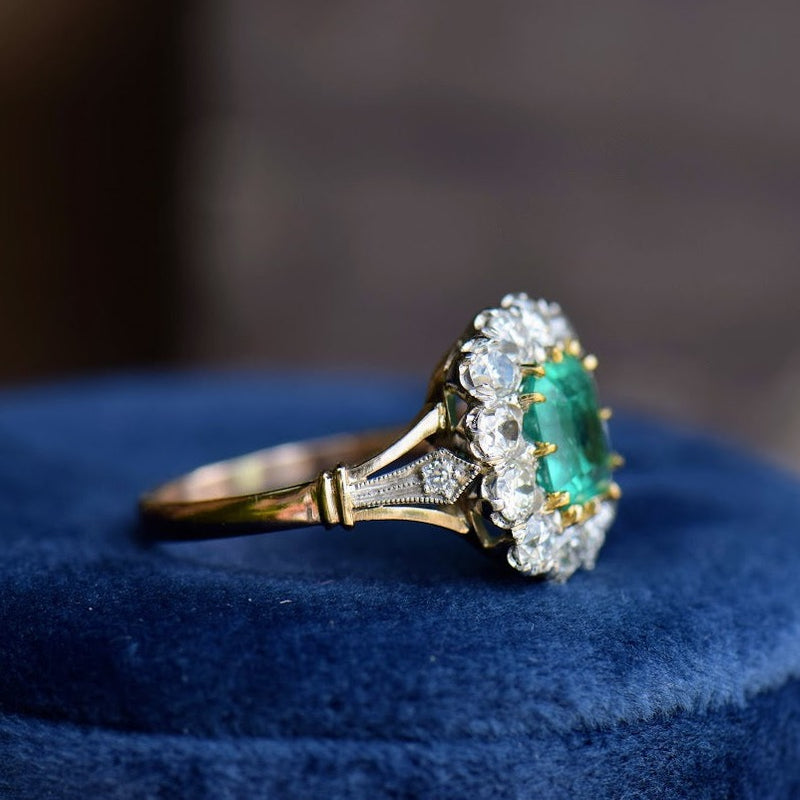 emerald and diamond mixed metal ring