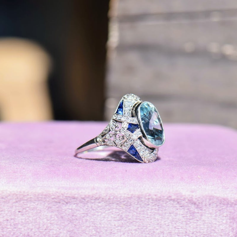 Blue zircon diamond and sapphire ring